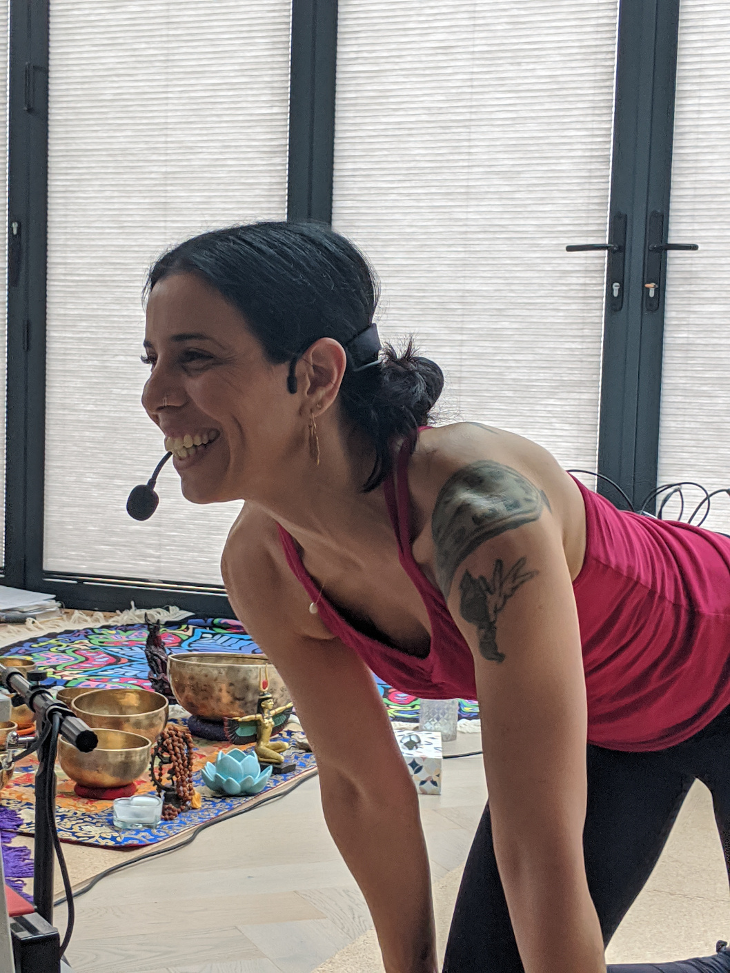 Peaceful wellness and meditation space with yoga mats, singing bowls, and natural elements